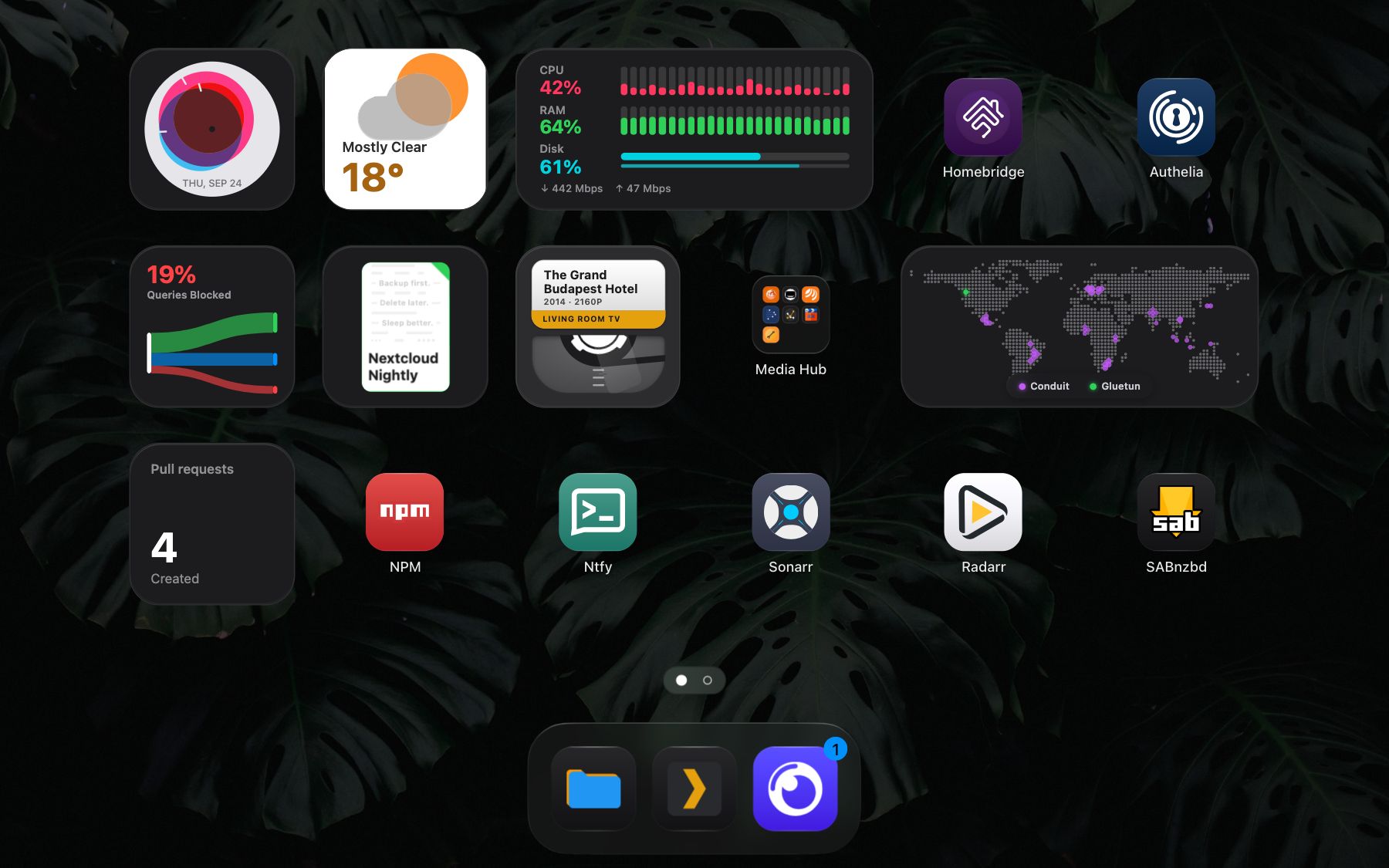 The Stackyard dashboard, with widgets, app tiles, two folders and the dock.